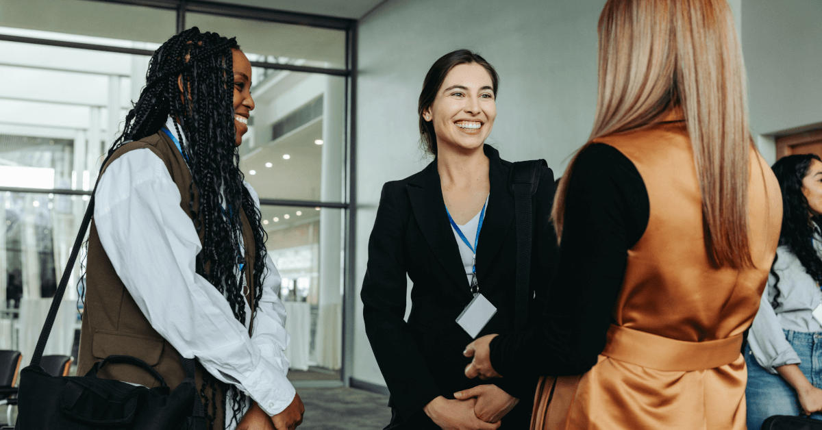 Three business women having a conversation.