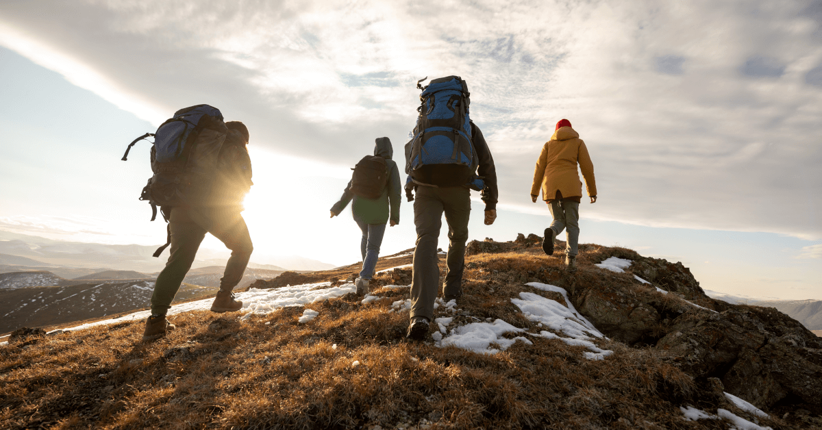 People traveling over a mountain path.