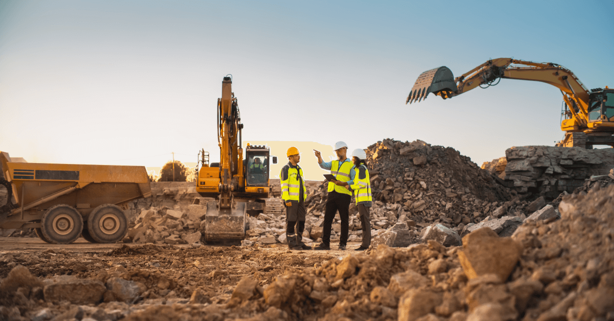 Workers and equipment at a construction site.