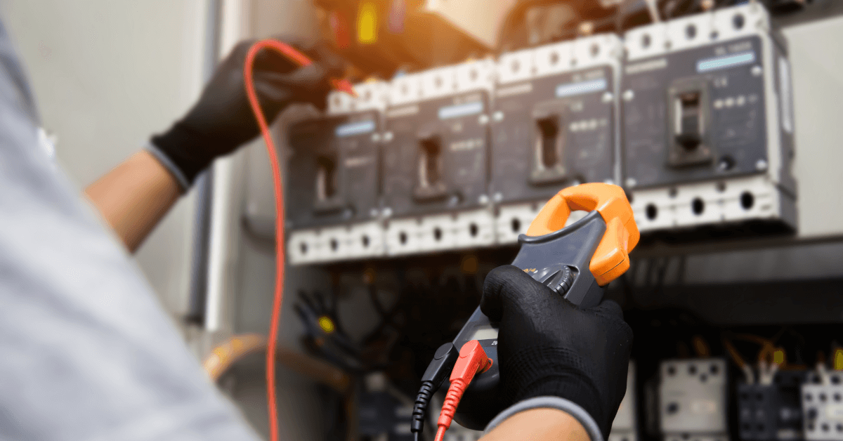 A technician using a measurement tool.