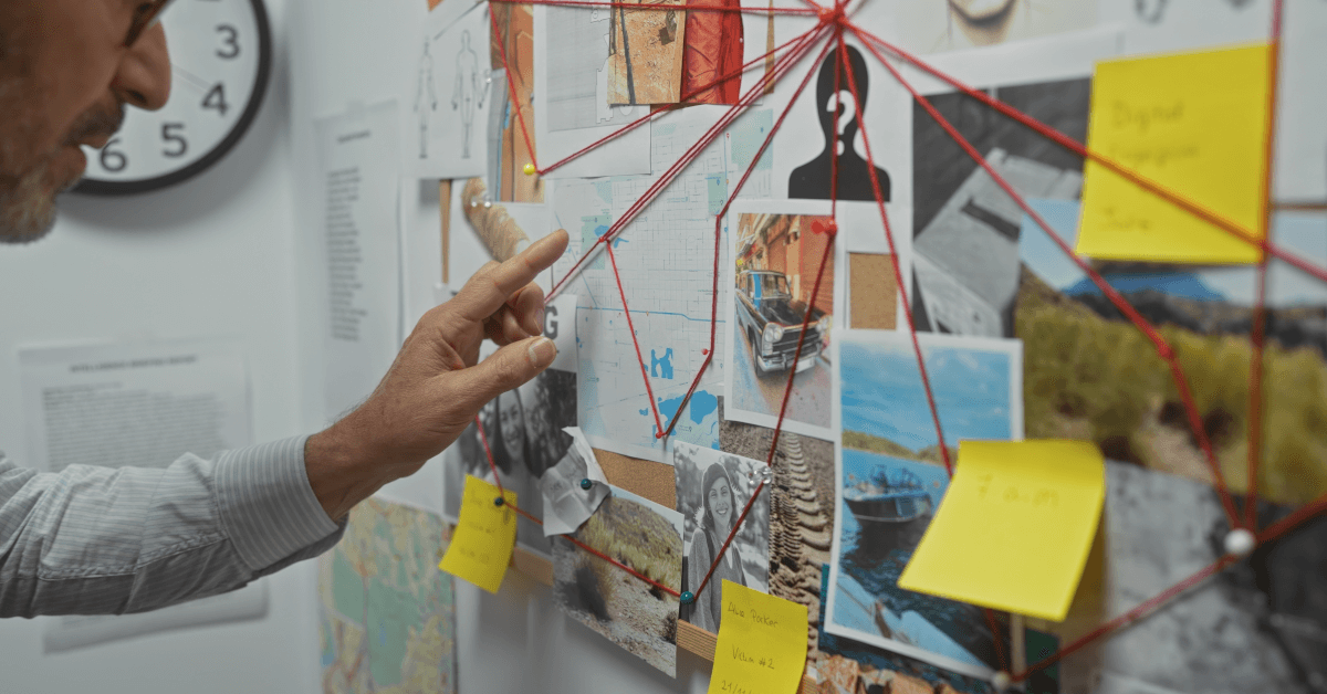 A man with a board connecting various information.