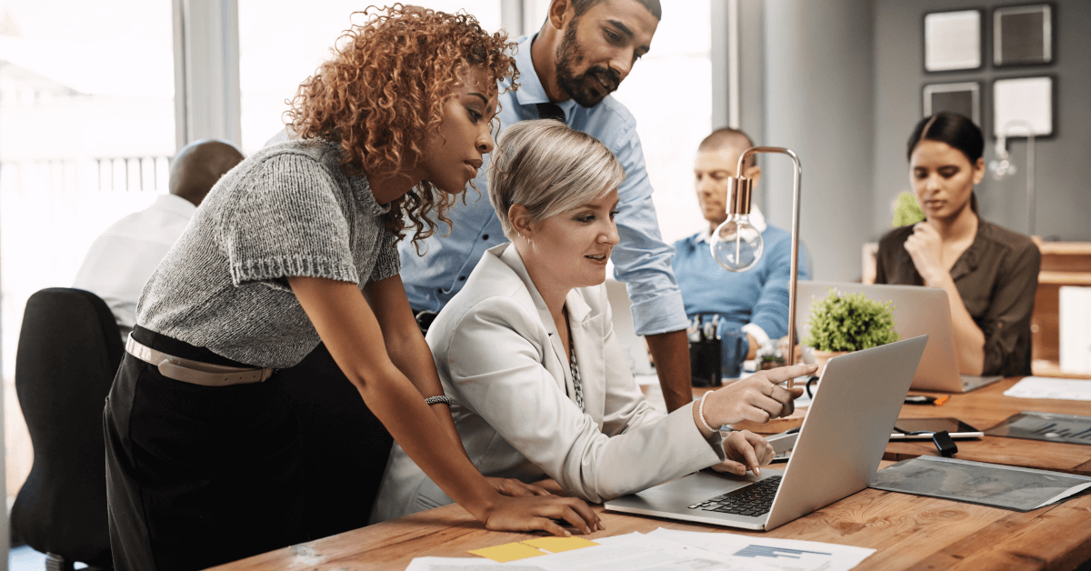 A group of support agents choosing help desk software.