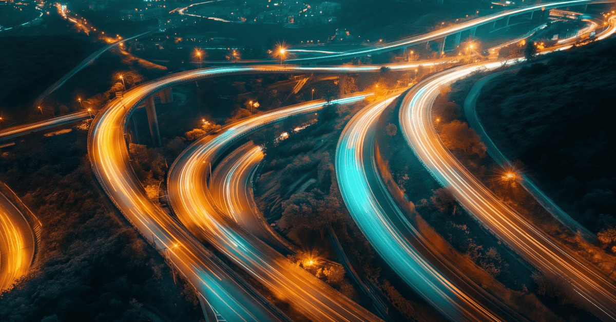 Cars moving quickly along multiple highways.