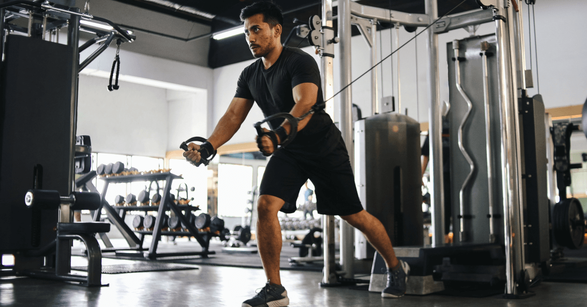 A man training at a gym.